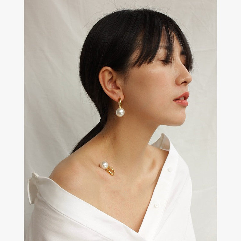 Gold-tone huggie hoops with pearl-style drop