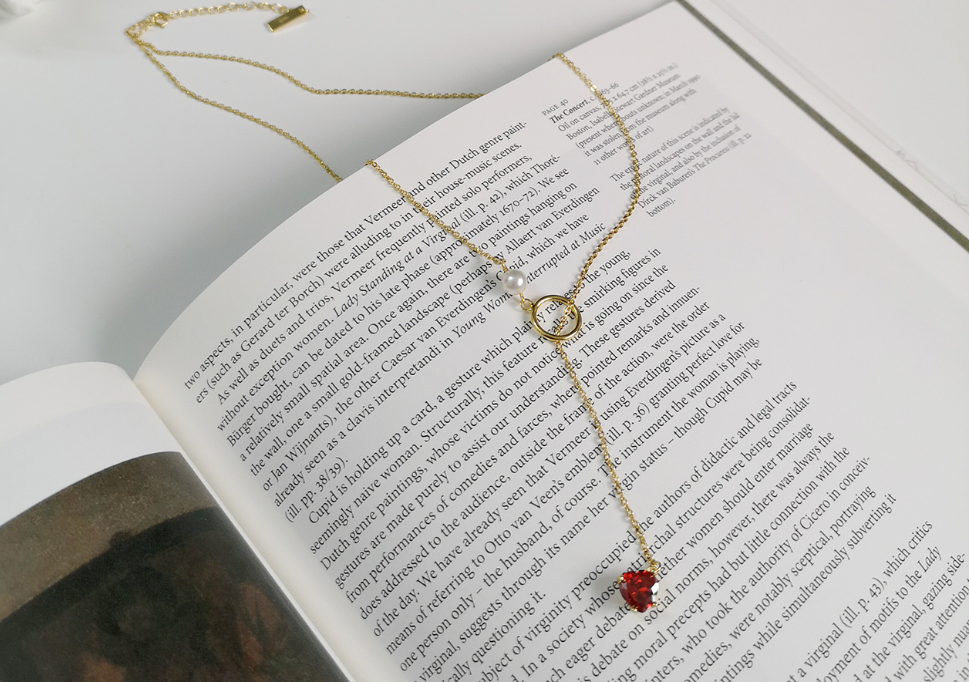 Gold-tone chain necklace with red heart pendant and pearl