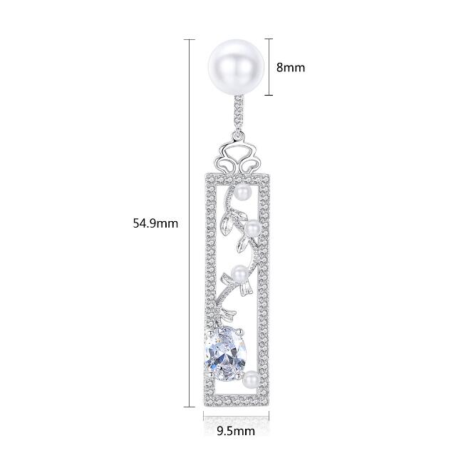 Long pearl-style drop earrings with decorated bar