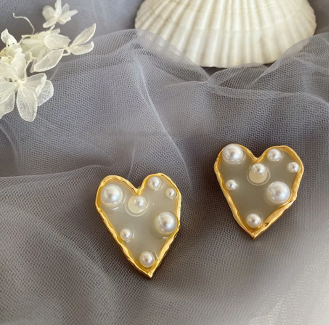 Gold-tone pearl-style earrings in a retro design