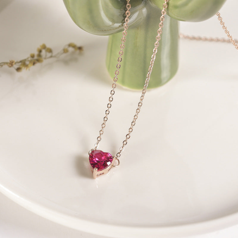 Pink heart stone pendant on rose gold-tone chain