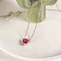 Pink heart stone pendant on rose gold-tone chain