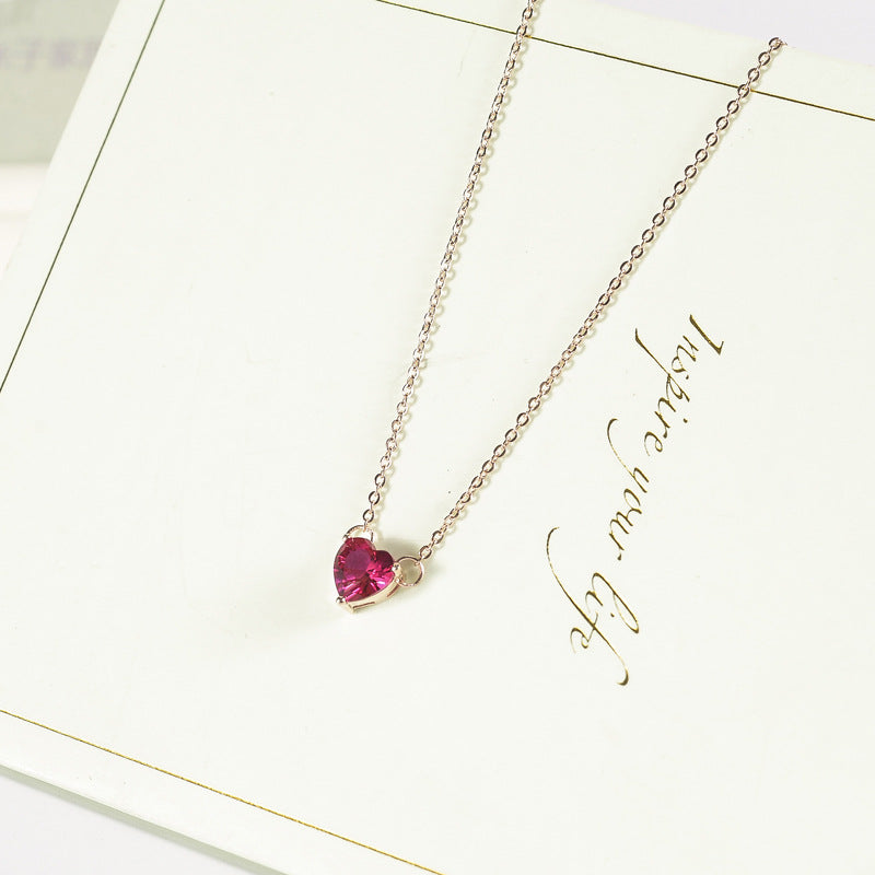 Pink heart stone pendant on rose gold-tone chain