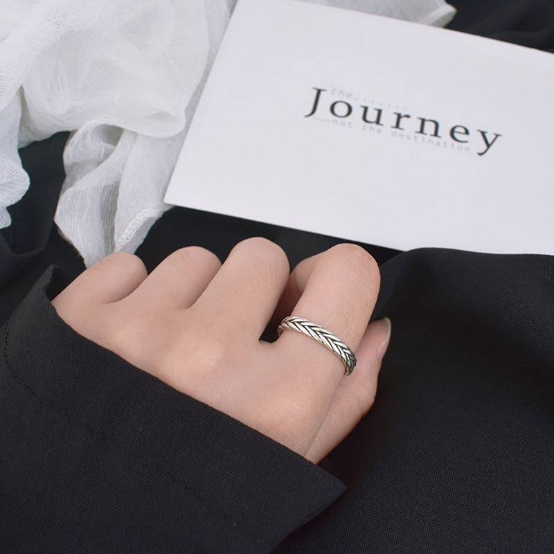 Silver-tone ring with woven braided pattern