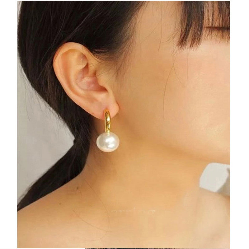 Gold-tone huggie hoops with pearl-style drop