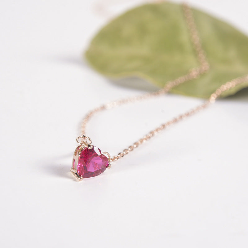 Pink heart stone pendant on rose gold-tone chain