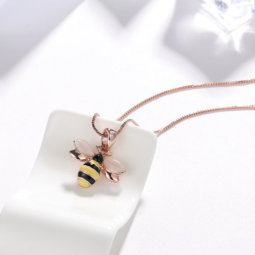 Rose gold-tone necklace with small bee pendant