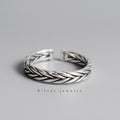 Silver-tone ring with woven braided pattern