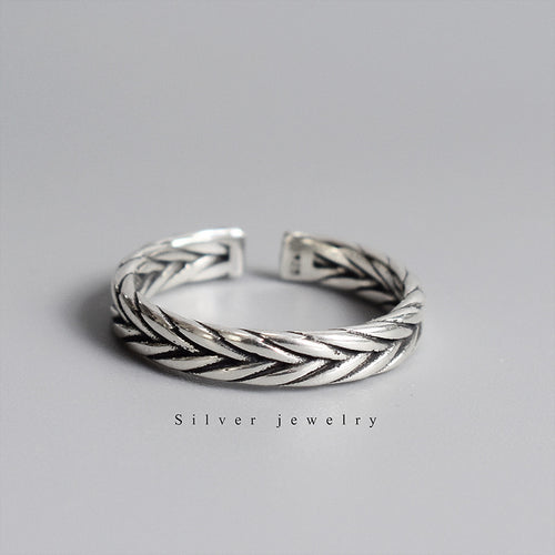 Silver-tone ring with woven braided pattern
