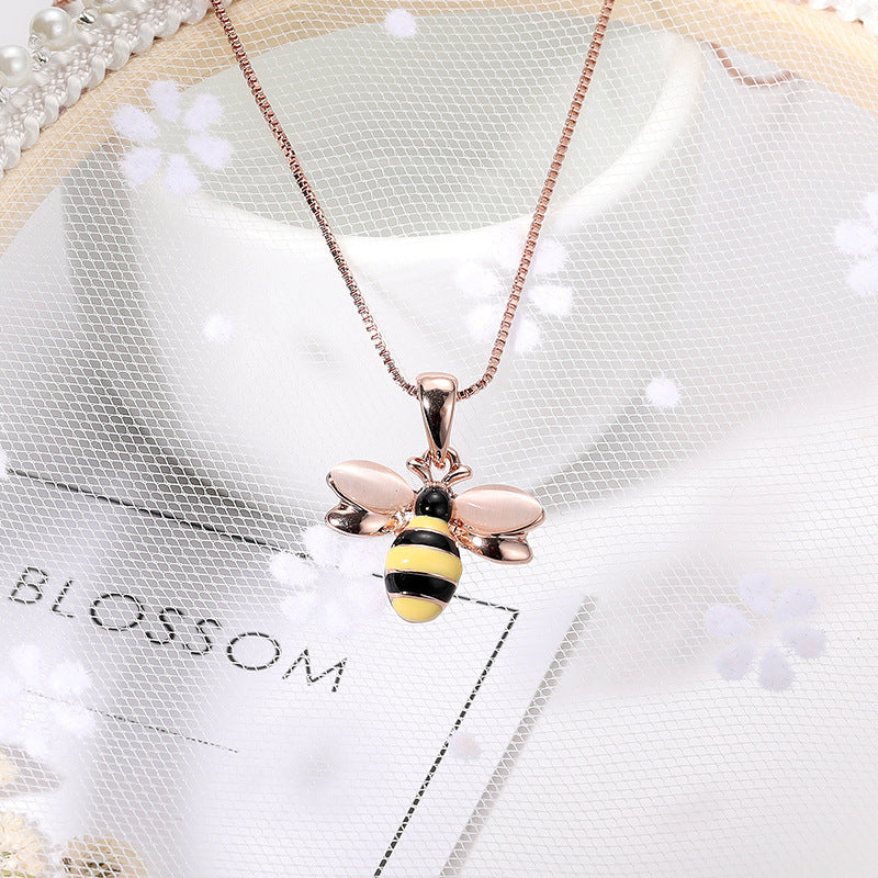 Rose gold-tone necklace with small bee pendant