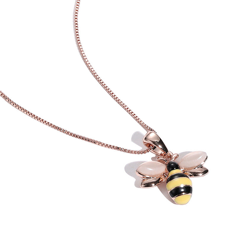 Rose gold-tone necklace with small bee pendant