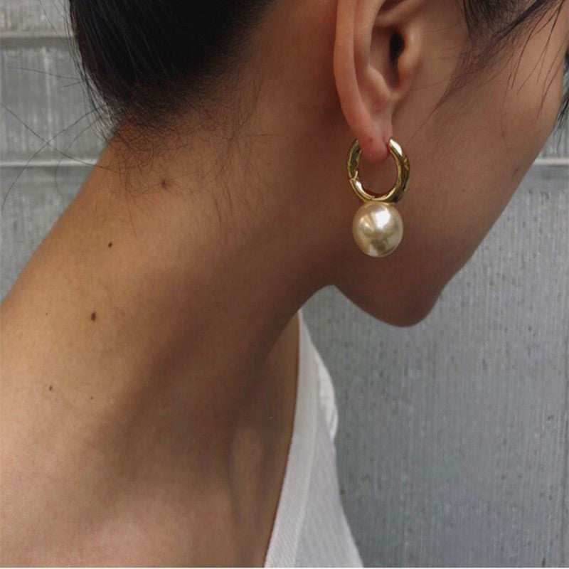 Gold-tone huggie hoops with pearl-style drop