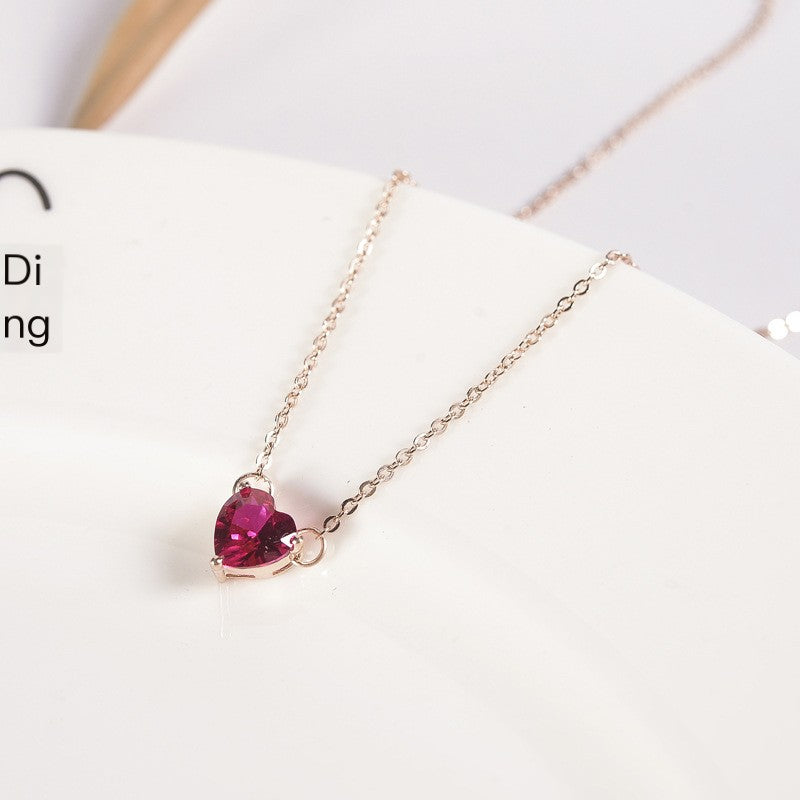 Pink heart stone pendant on rose gold-tone chain