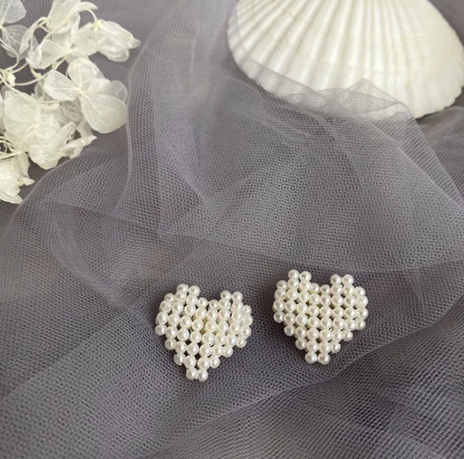 Gold-tone pearl-style earrings in a retro design